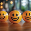 three yellow spheres with smiling faces.